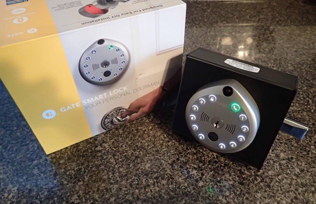 gate smart lock displayed on test block next to packaging